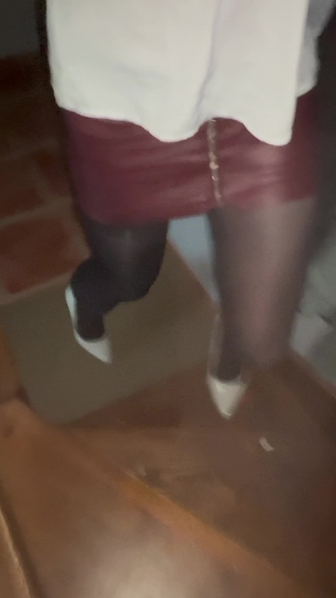 Crossdresser in leather dress